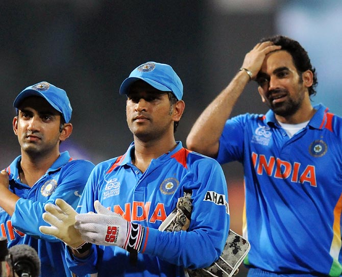 India captain Mahendra Singh Dhoni (centre) with Gautam Gambhir (left) and Zaheer Khan