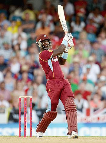 Darren Sammy of the West Indies hits six runs during the 2nd T20 International match against England at Kensington Oval in Bridgetown, Barbados on Tuesday
