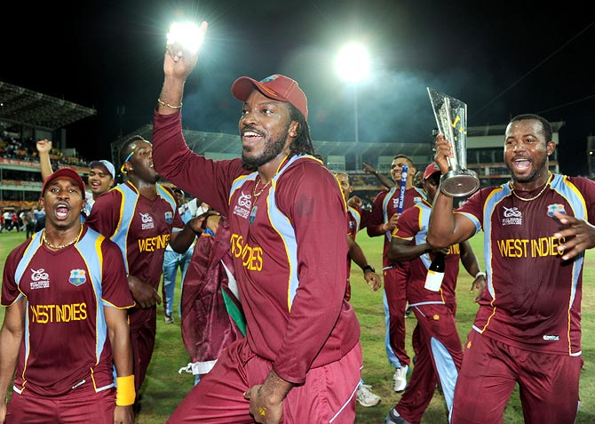 Chris Gayle (centre) celebrates with his team mates after winning the World T20 title in October 2012