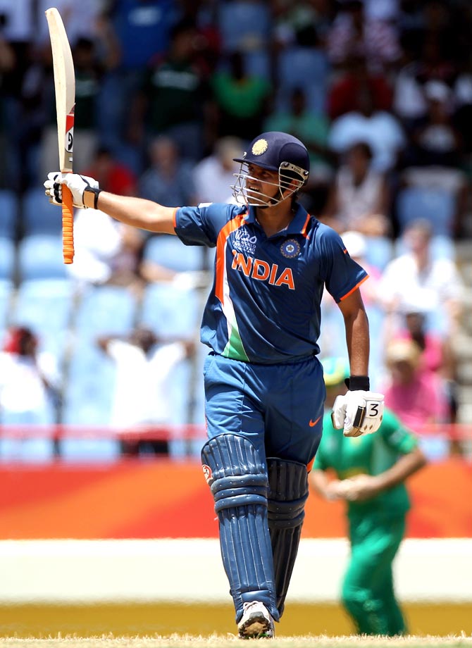 Suresh Raina celebrates his century during a 2010 World Twenty20 game against South Africa.