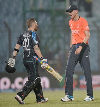 England captain Stuart Broad speaks with New Zealand captain Brendan McCullum as rain stops play on Saturday