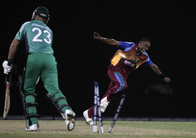 Dwayne Bravo of West Indies celebrates the wicket of Trent Johnston of Ireland v Guyana
