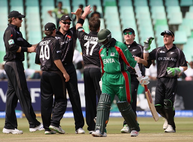 Steve Tikolo of Kenya leaves the field as the New Zealand team celebrate his wicket