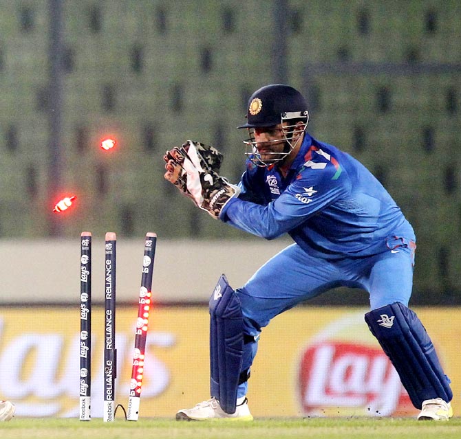 Mahendra Singh Dhoni breaks the stumps to effect a stumping during the ICC World Twenty20 match against Bangladesh in Mipur.