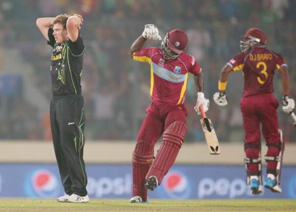 Australia pacer James Faulkner reacts as Darren Sammy (centre) of the West Indies hits a six in the final over during the ICC World Twenty20 Bangladesh 2014 on Friday.