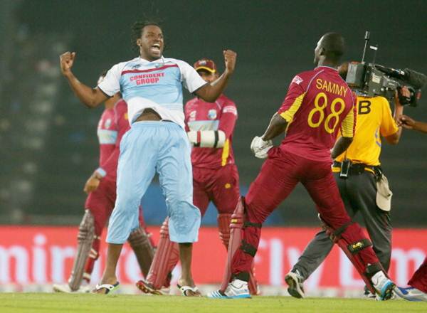 Chris Gayle and the West Indies players celebrate after Sammy clinches victory
