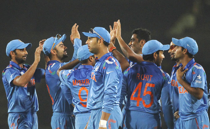India's fielders celebrate the dismissal of Bangladesh's Shamsur Rahman