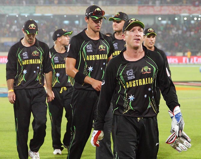 The Australian team leave the field after losing their match against West Indies at the World T20 in Dhaka