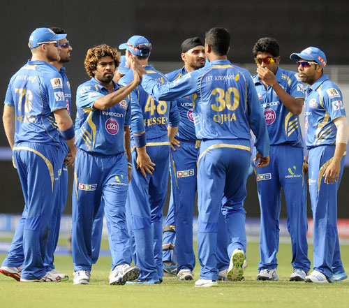 Lasith Malinga is congratulated by Mumbai Indians teammates after taking a wicket