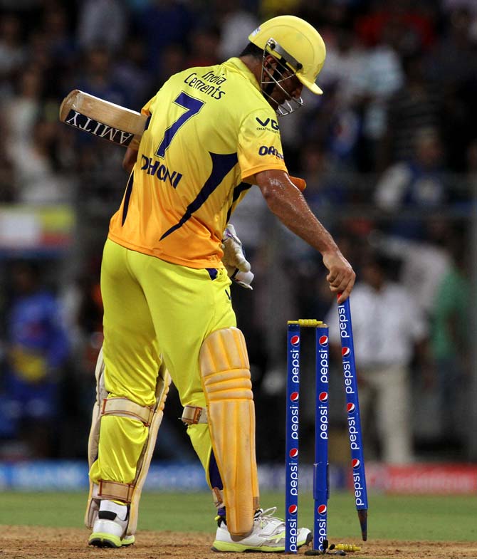 Mahendra Singh Dhoni removes the stump after hitting the winning runs for Chennai.