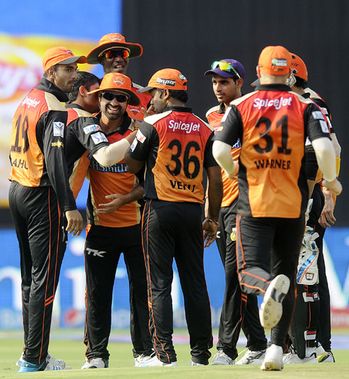 Sunrisers Hyderabad players celebrate the fall of a Bangalore wicket