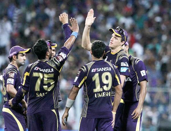The Kolkata Knight Riders players celebrate after the fall of AB de Villiers's wicket.