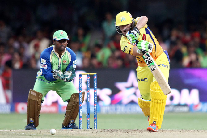 Chennai' Faf du Plessis plays a shot as RCB's Yogesh Takawale looks on