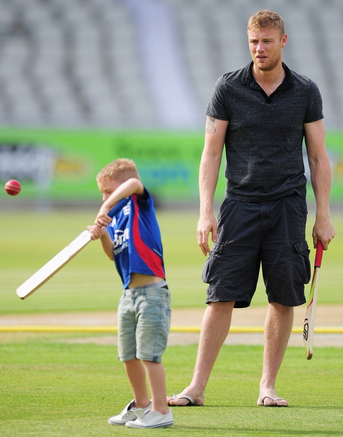 Former Lancashire and England player Andrew 'Freddie' Flintoff looks on as his son Rocky plays a shot