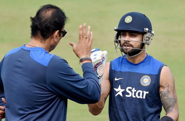 Virat Kohli, right, speaks to Ravi Shastri. Photograph: PTI