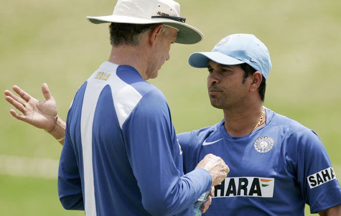 A file photo of India's Sachin Tendulkar (right) speaking with team coach Greg Chappell during a practice session