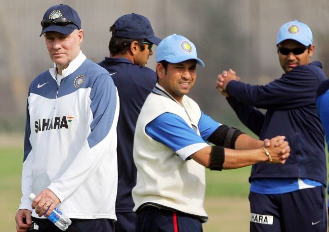 Sachin Tendulkar, Rahul Dravid and Virender Sehwag warm-up as coach Greg Chappell looks on