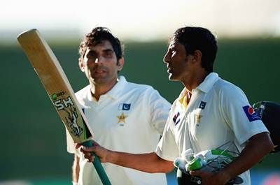 Younis Khan and Misbah-ul Haq of Pakistan acknowledge the crowd as they leave the field after scoring centuries during Day 2 of the first Test against New Zealand at the Sheikh Zayed stadium in Abu Dhabi.