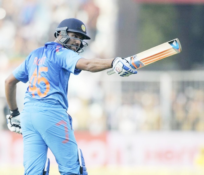 Rohit Sharma celebrates after completing a double hundred against Sri Lanka in the fourth ODI