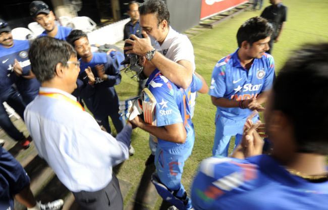 Ravi Shastri, Director of Cricket for the Indian cricket team, congratulates Rohit Sharma at the end of India's innings