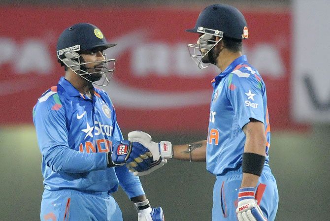 Ambati Rayudu of India is congratulated by his captain Virat Kohli after completing his half century in Ranchi