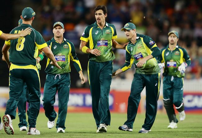 Mitchell Starc, centre, of Australia celebrates