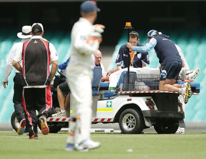 Phillip Hughes of South Australia lays on a stretcher after being struck in the head by a delivery during day one of the Sheffield Shield match between New South Wales and South Australia at Sydney Cricket Ground on Tuesday