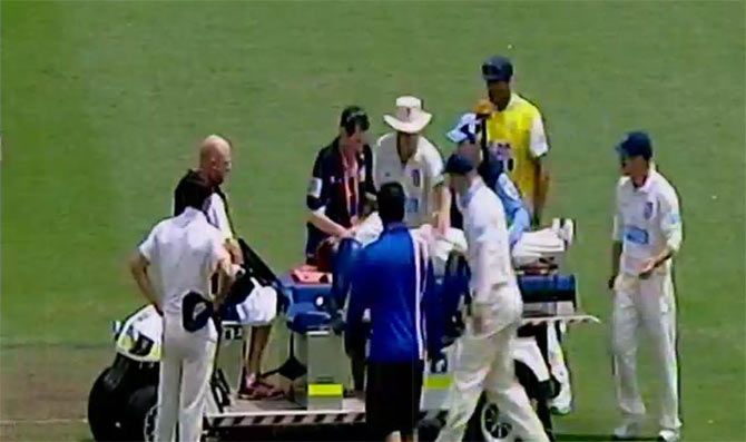Phillip Hughes of South Australia lays on a stretcher after being struck in the head by a delivery 