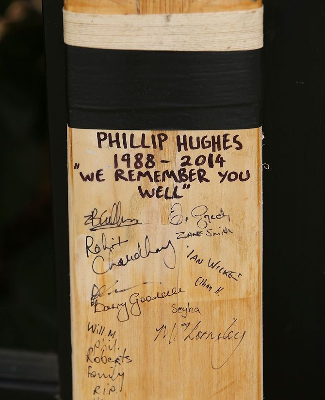 A cricket bat with signatures which as been placed as a tribute to Phillip Hughes is seen   outside the ground at the WACA 