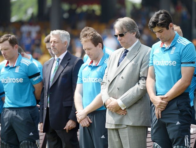 From left, Eoin Morgan, ICC chief executive David Richardson, ECB Chairman Giles Clarke and England captain Alastair Cook observe a minutes silence in memory of Australian cricketer Phil Hughes