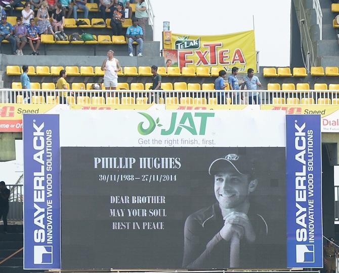 The crowd observe a minutes silence in memory of Australian cricketer Phil Hughes