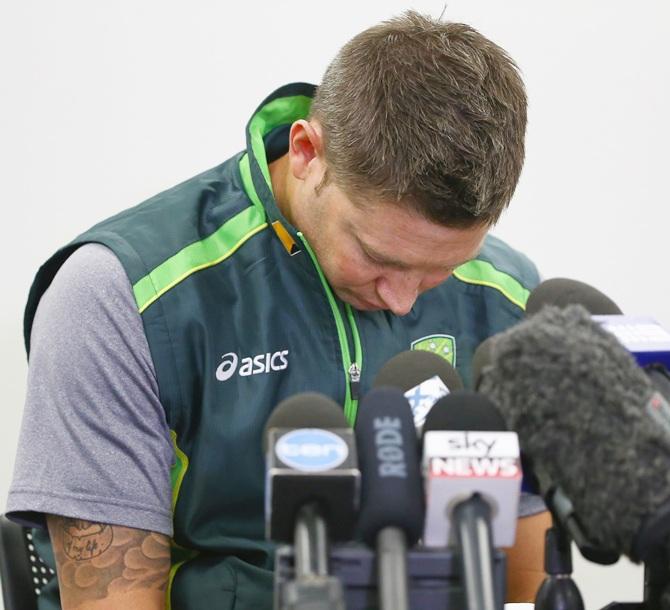 Australian cricket captain Michael Clarke pauses as he reads a statement