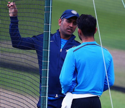 Mahendra Singh Dhoni chats with Virat Kohli during an India nets session ahead of the first Investec Test Series at Trent Bridge on July 8, 2014 in Nottingham, England. Photograph: Matthew Lewis/Getty Images