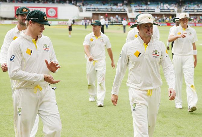 Australian players leave the field 