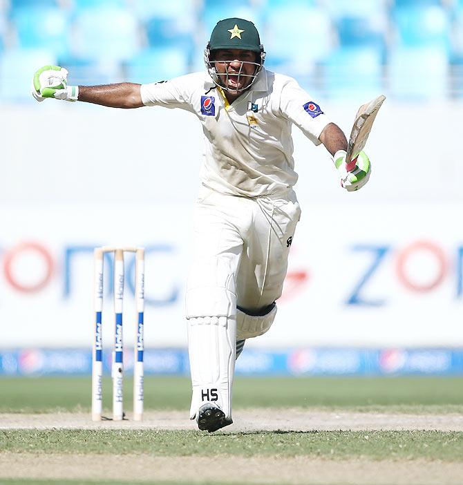 Sarfraz Ahmed of Pakistan celebrates after reaching his century during Day Two of the First Test between Pakistan and Australia at Dubai International Stadium on Thursday