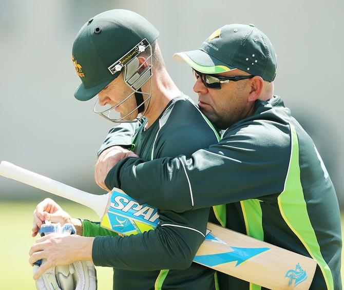 Darren Lehmann, right, of Australia speaks to Michael Clarke, left, during an Australian nets session 