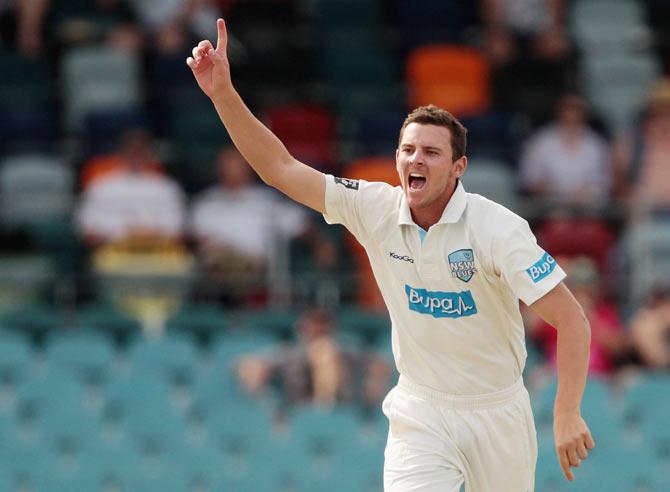 Josh Hazlewood of the Blues celebrates