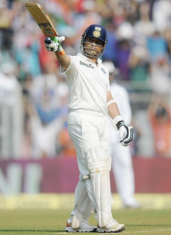 Sachin Tendulkar celebrates after scoring his half century