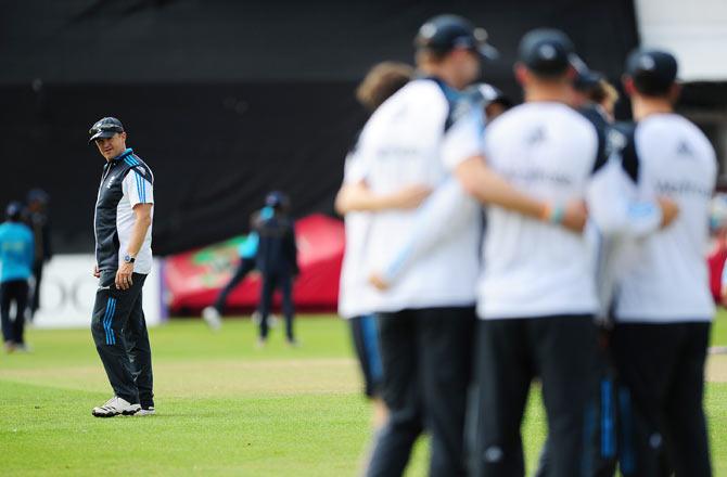 Andy Flower, left, England's then head coach, looks on during a net session