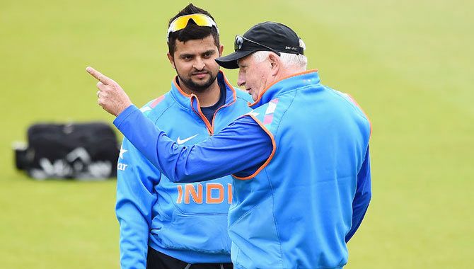 Team India coach Duncan Fletcher talks with Suresh Raina during net practice