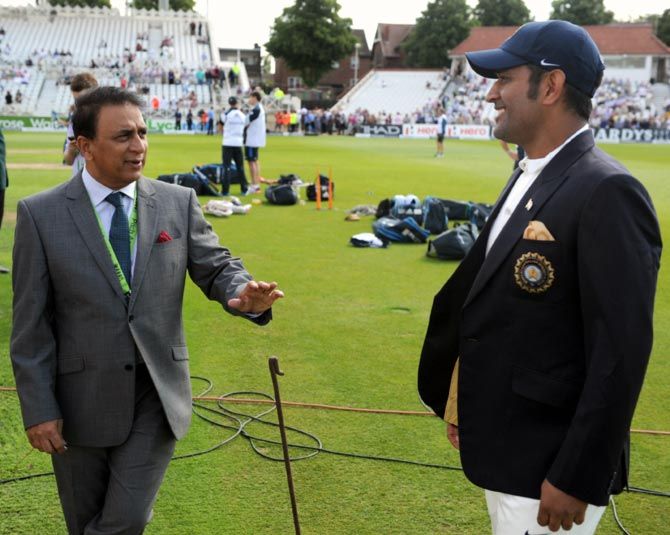 Sunil Gavaskar, left, speaks to then India Captain Mahendra Singh Dhoni. Photograph: Gareth Copley/Getty Images