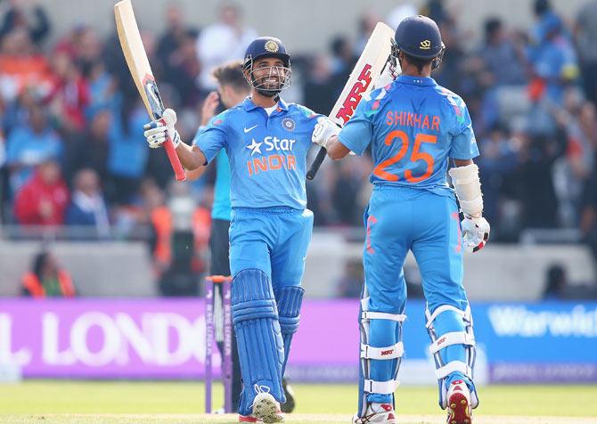 India's Shikhar Dhawan is congratulated by teammate Ajinkya Rahane during the fourth one-dayer against England at Edgbaston