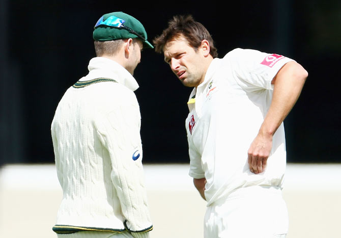 Australia's Ben Hilfenhaus with captain Michael Clarke