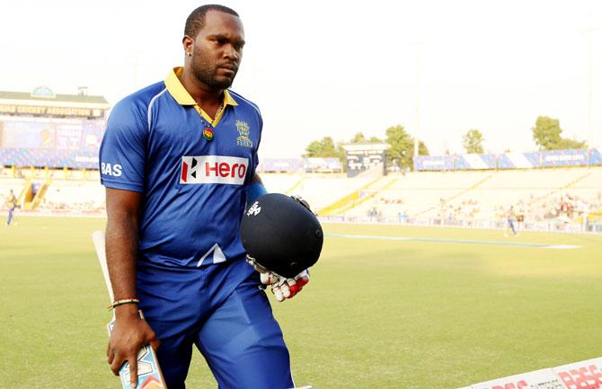 Jonathan Carter walks back after scoring a century