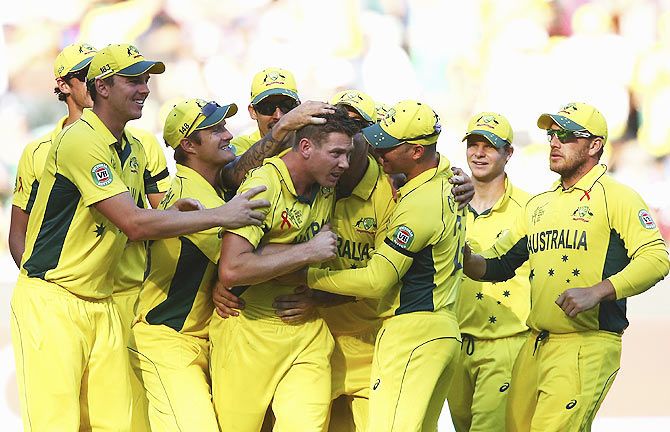 Australia's James Faulkner (centre) celebrates after taking a wicket during the 2015 ICC World Cup final against New Zealand