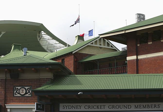 Flags fly at half mast in a tribute to Richie Beanud at the Sydney Cricket Ground on Friday