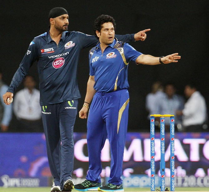 Sachin Tendulkar, right, with Harbhajan Singh