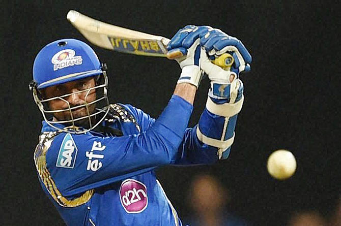 Mumbai Indians batsman Harbhajan Singh plays a shot against Kings XI Punjab during their Indian Premier League T20 match in Mumbai on Sunday