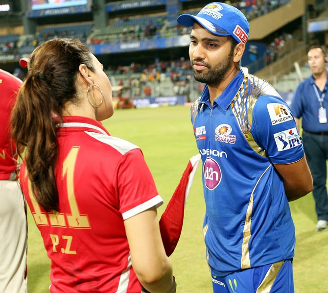 Preity Zinta owner of Kings XI Punjab speaks with Mumbai Indians captain Rohit Sharma