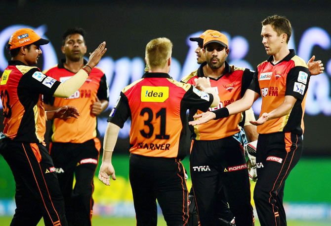 Sunrisers Hyderabad Trent Boult celebrates with teammates after claiming the wicket of Royal Challengers Bangalore's AB De Villiers during their IPL match at Chinnaswamy Stadium in Bengaluru on Monday